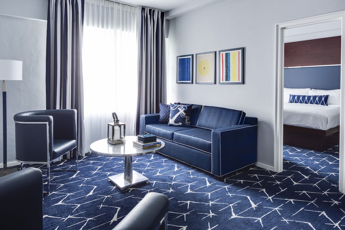 Executive Suite, 1 Bedroom, Ensuite, Pool View | Living area | 40-inch flat-screen TV with satellite channels, TV, iPod dock