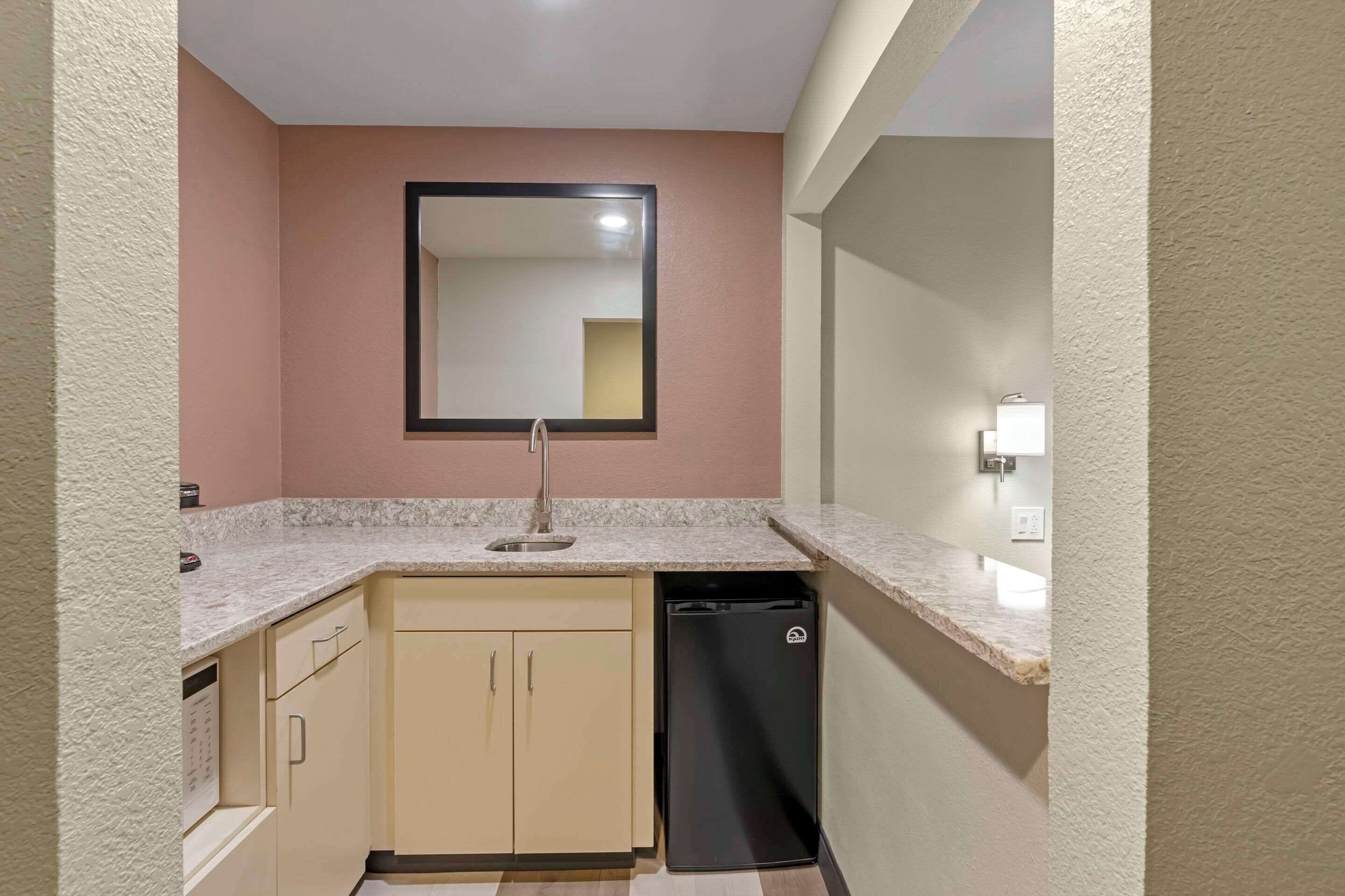 room, 1 king bed, non smoking (upgrade) | blackout curtains, iron/ironing board, bed sheets, alarm clocks