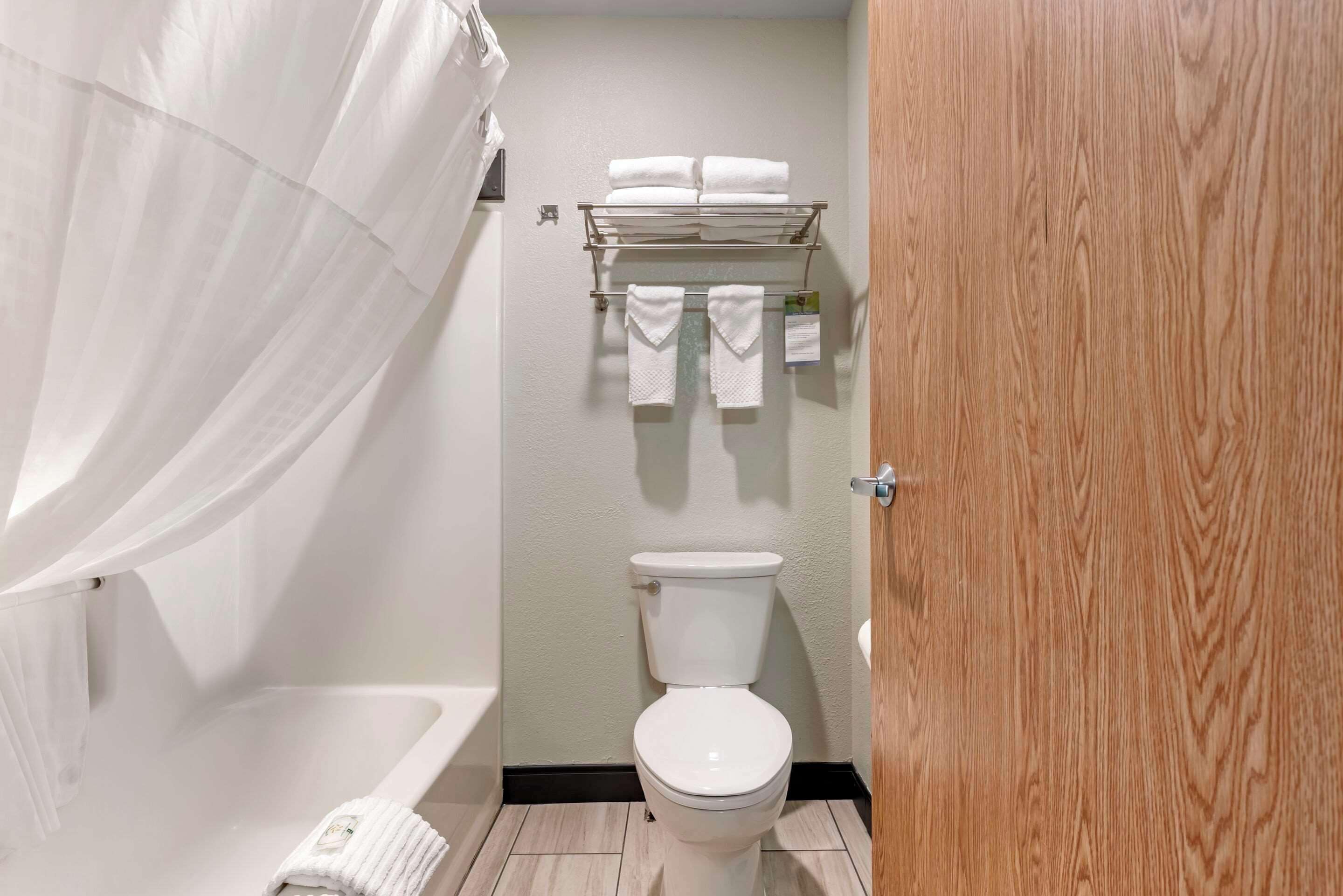 blackout curtains, iron/ironing board, bed sheets, alarm clocks