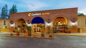 A brick building with a sign reading 'Comfort SUITES' and multiple arches. - Comfort Suites Tucson near Sabino Canyon (Tucson)