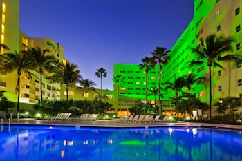 Outdoor pool, sun loungers at Holiday Inn Miami Beach - Oceanfront, an IHG Hotel