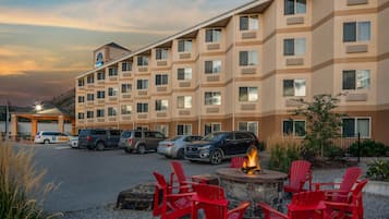 Experience the comfort of a Marriott hotel with a fire pit and outdoor seating area.