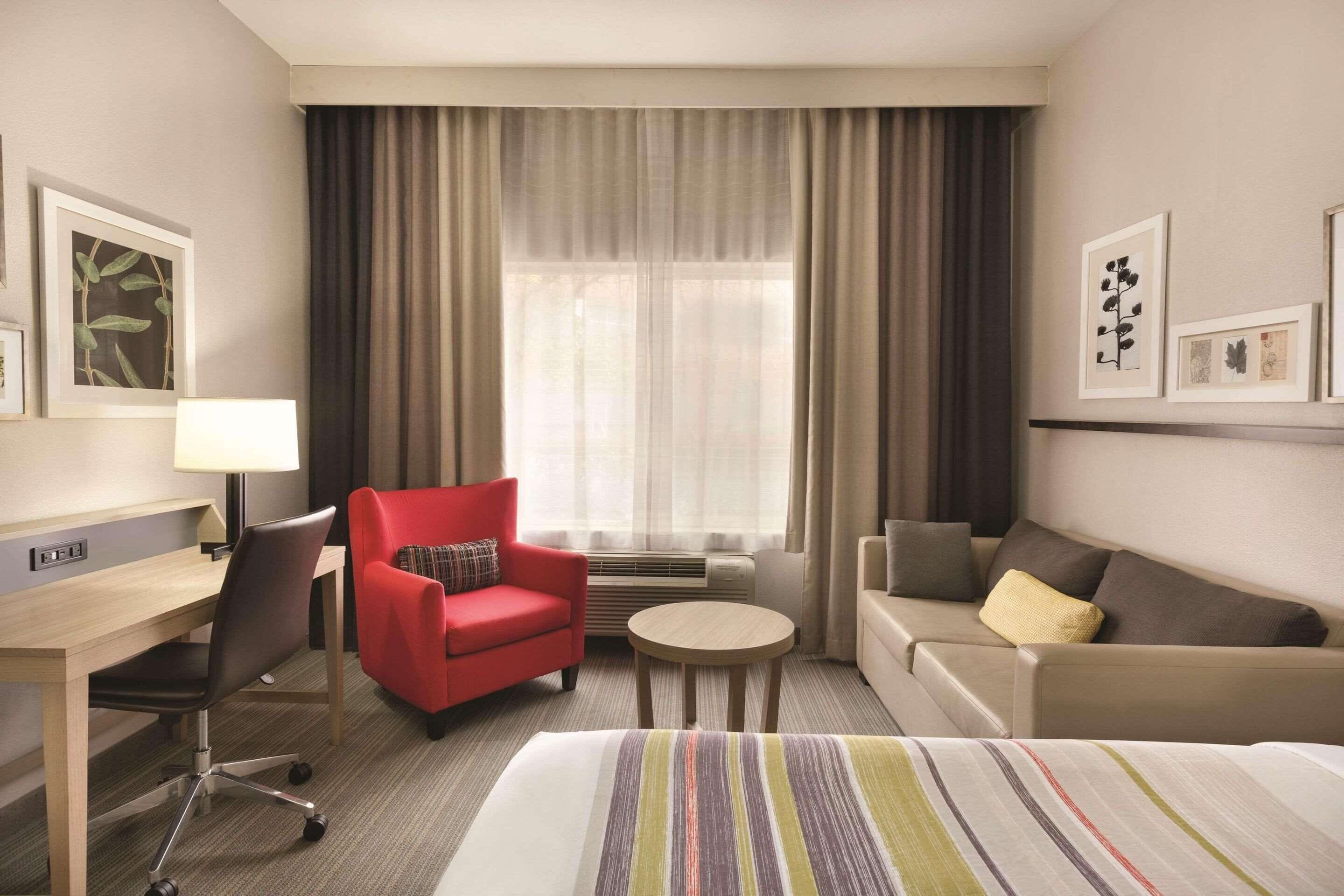 desk, blackout curtains, iron/ironing board, free cots/infant beds