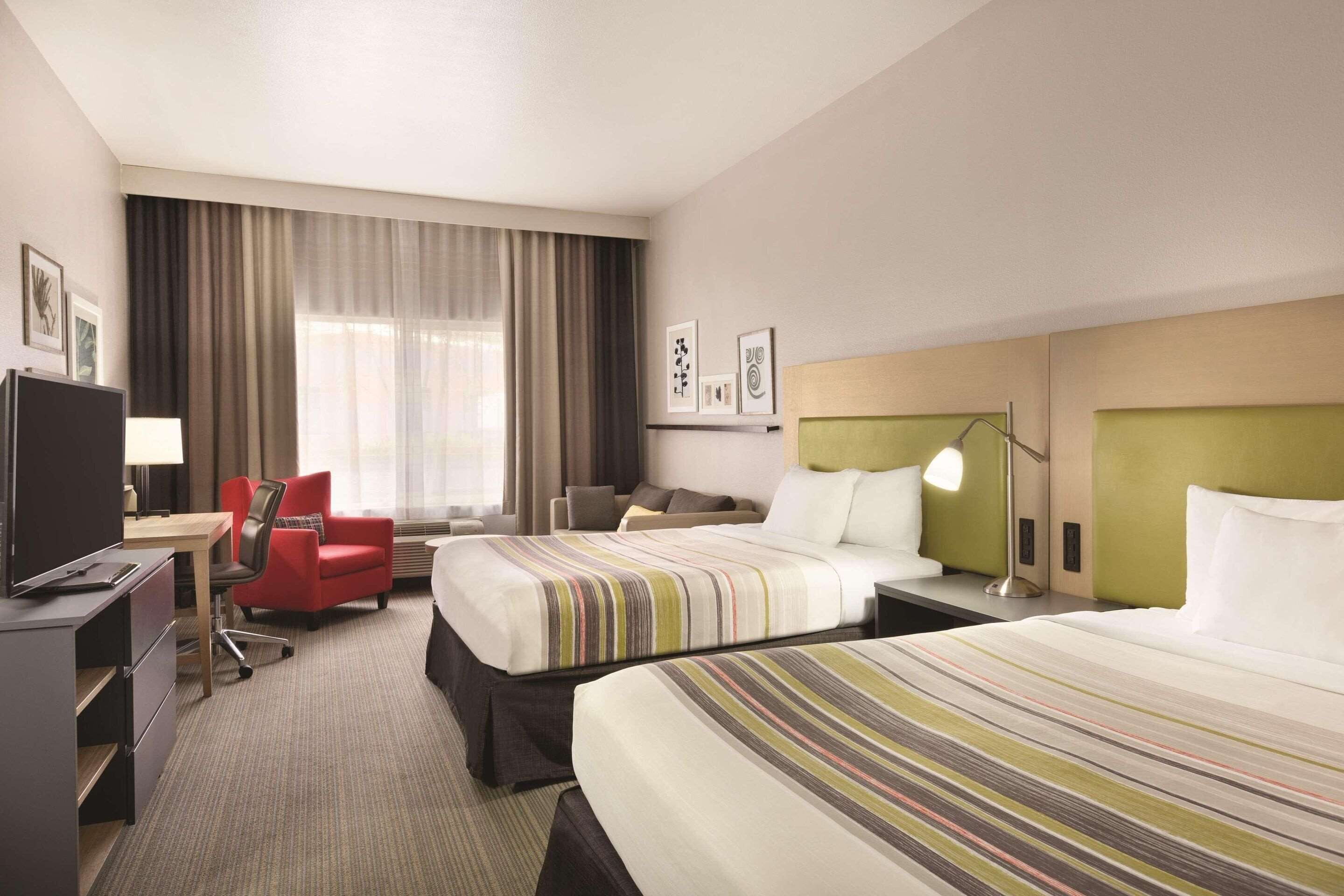 room, 2 queen beds, non smoking | desk, blackout curtains, iron/ironing board, free cots/infant beds