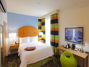 In-room safe, desk, laptop workspace, blackout drapes at Claremont Miami Beach