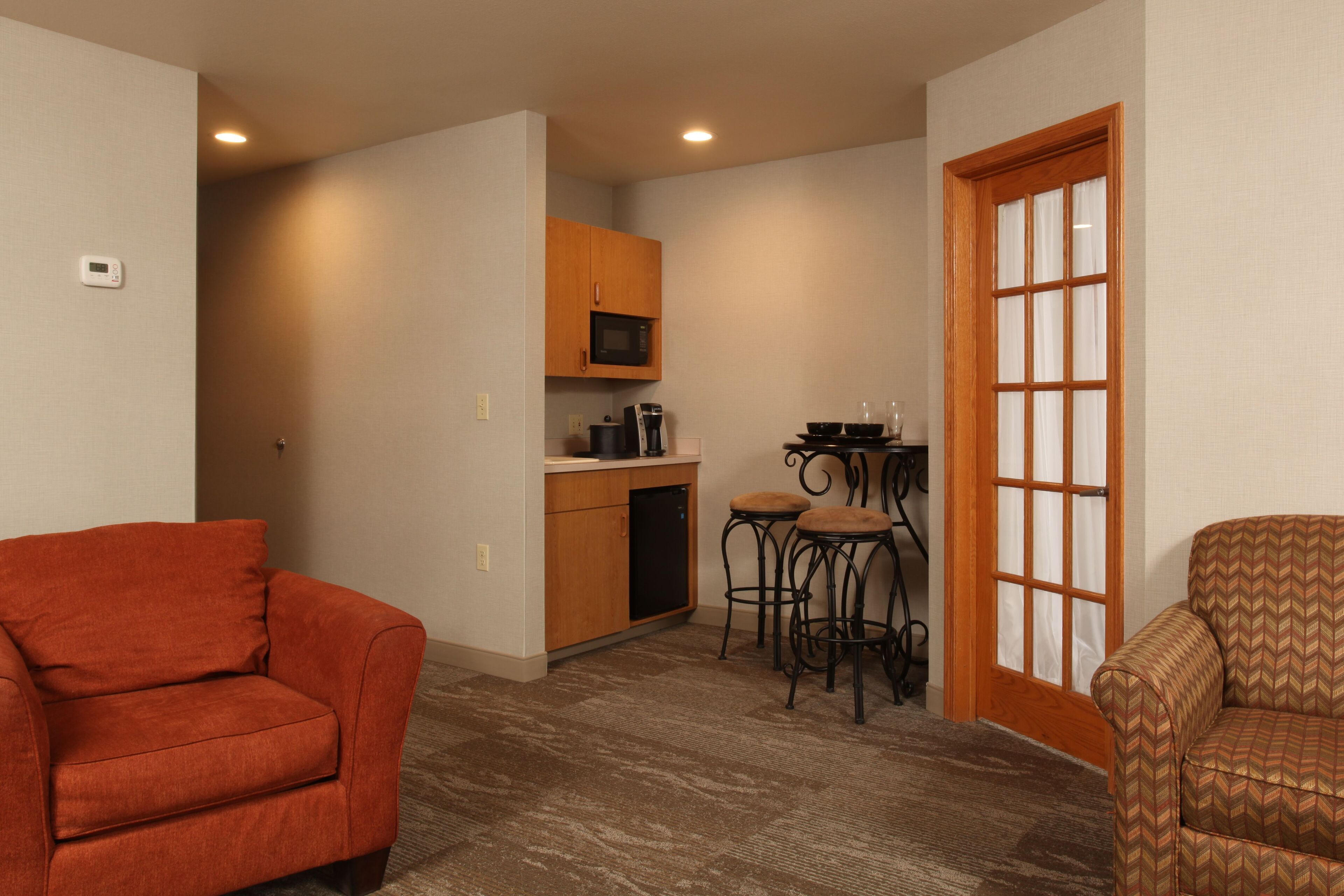 suite, 2 queen beds, non smoking, fireplace | living area | 49-inch flat-screen tv with digital channels, tv, ipod dock