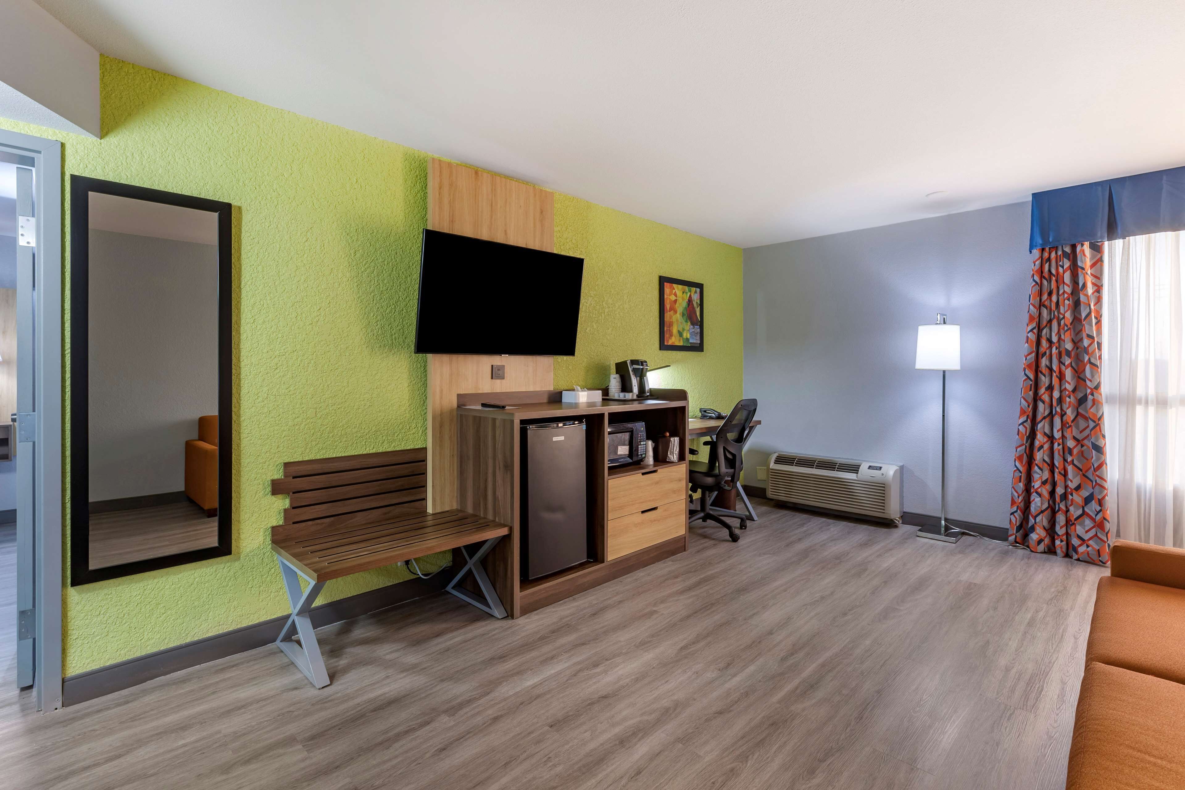 suite, 1 queen bed, non smoking, refrigerator & microwave | desk, laptop workspace, blackout curtains, iron/ironing board