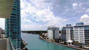 A waterfront view of modern buildings with a marina and docked boats. - Sixty Sixty Resort (Miami Beach)