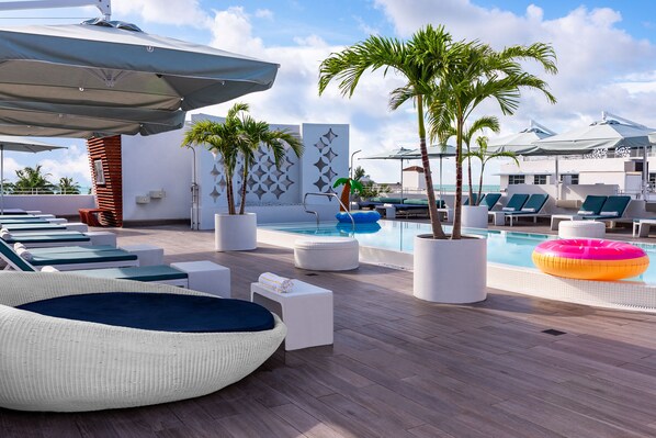 Outdoor pool, open 9:00 AM to 5:30 PM, pool umbrellas, pool loungers