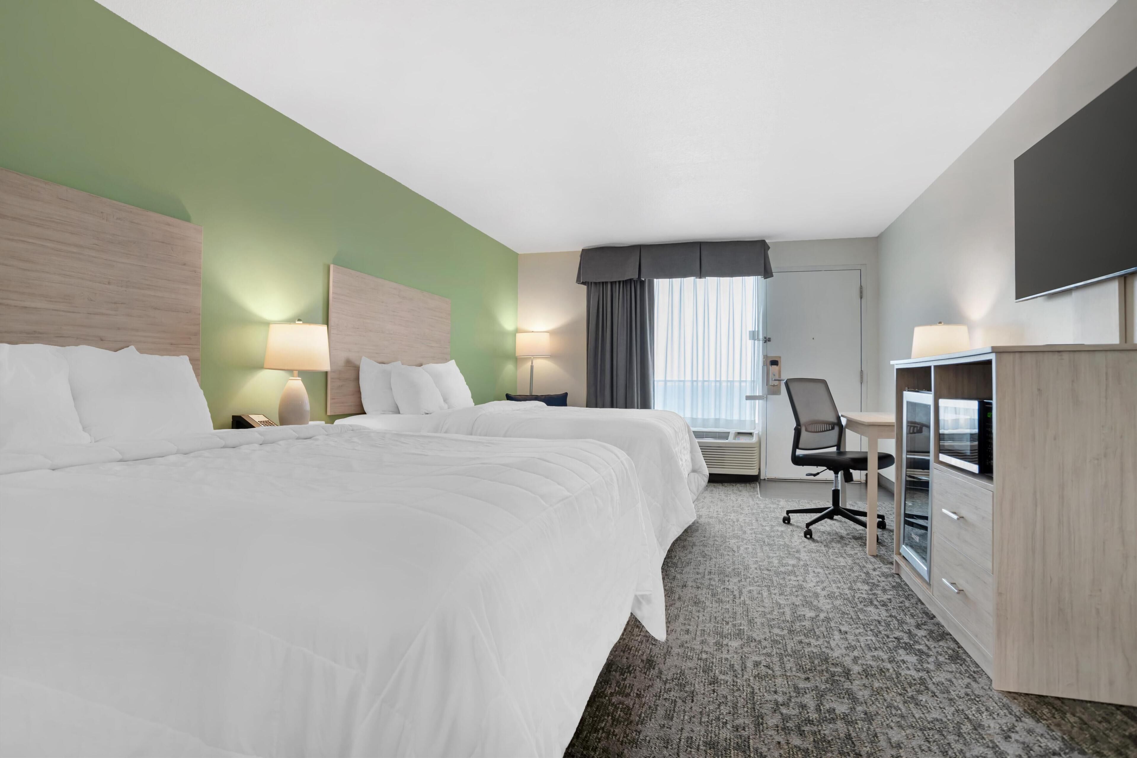 standard room, 2 queen beds, microwave, pool view | 1 bedroom, premium bedding, desk, laptop workspace