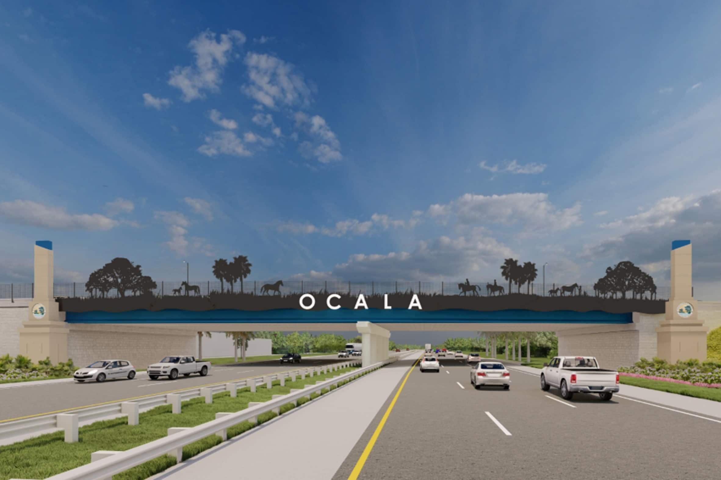 A highway overpass with the word "OCALA" and silhouettes of horses and trees.