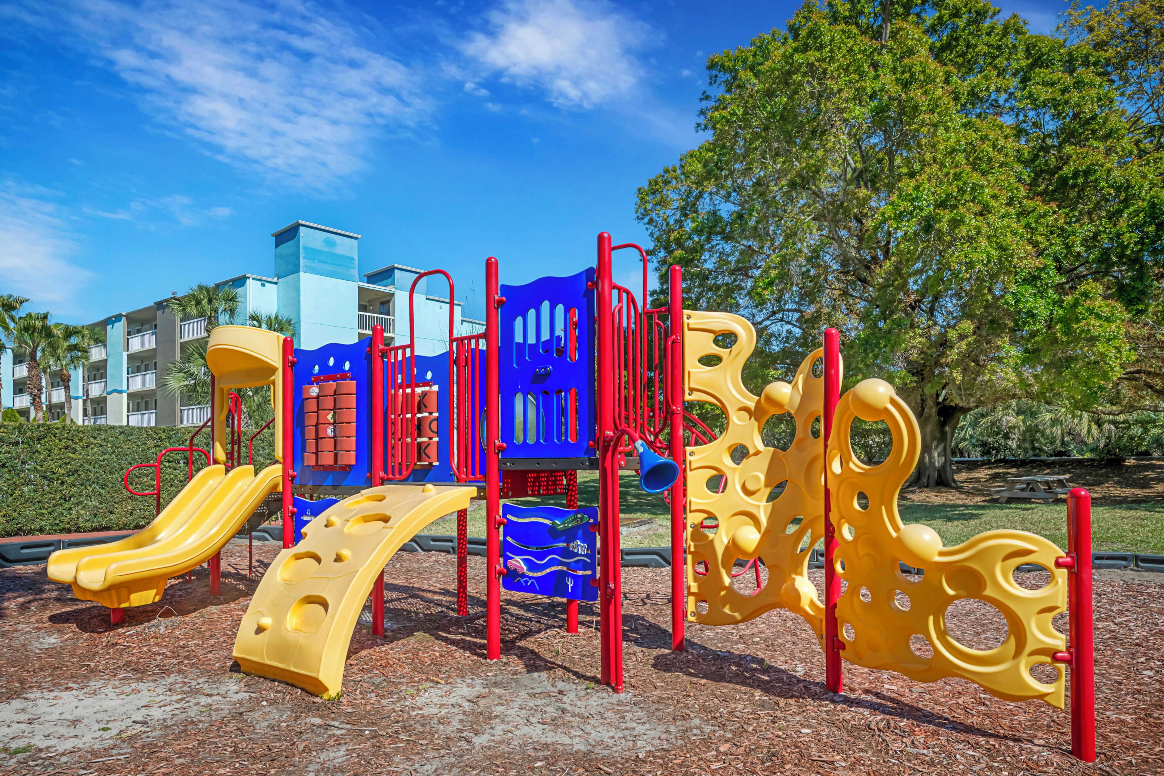 A playground with slides and climbing structures.