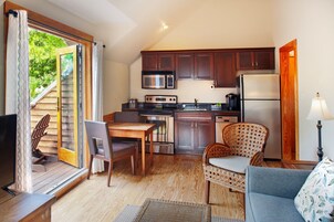 Full-sized fridge, microwave, stovetop, coffee/tea maker