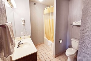 Suite, 1 King Bed, Non Smoking | Bathroom | Combined shower/tub, spring water tub, free toiletries, hair dryer