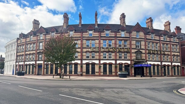 A historic building with multiple stories, a prominent sign reading 'BRITANNIA HOTEL,' and a clear blue sky in the background. - Britannia Hotel Wolverhampton (Wolverhampton)