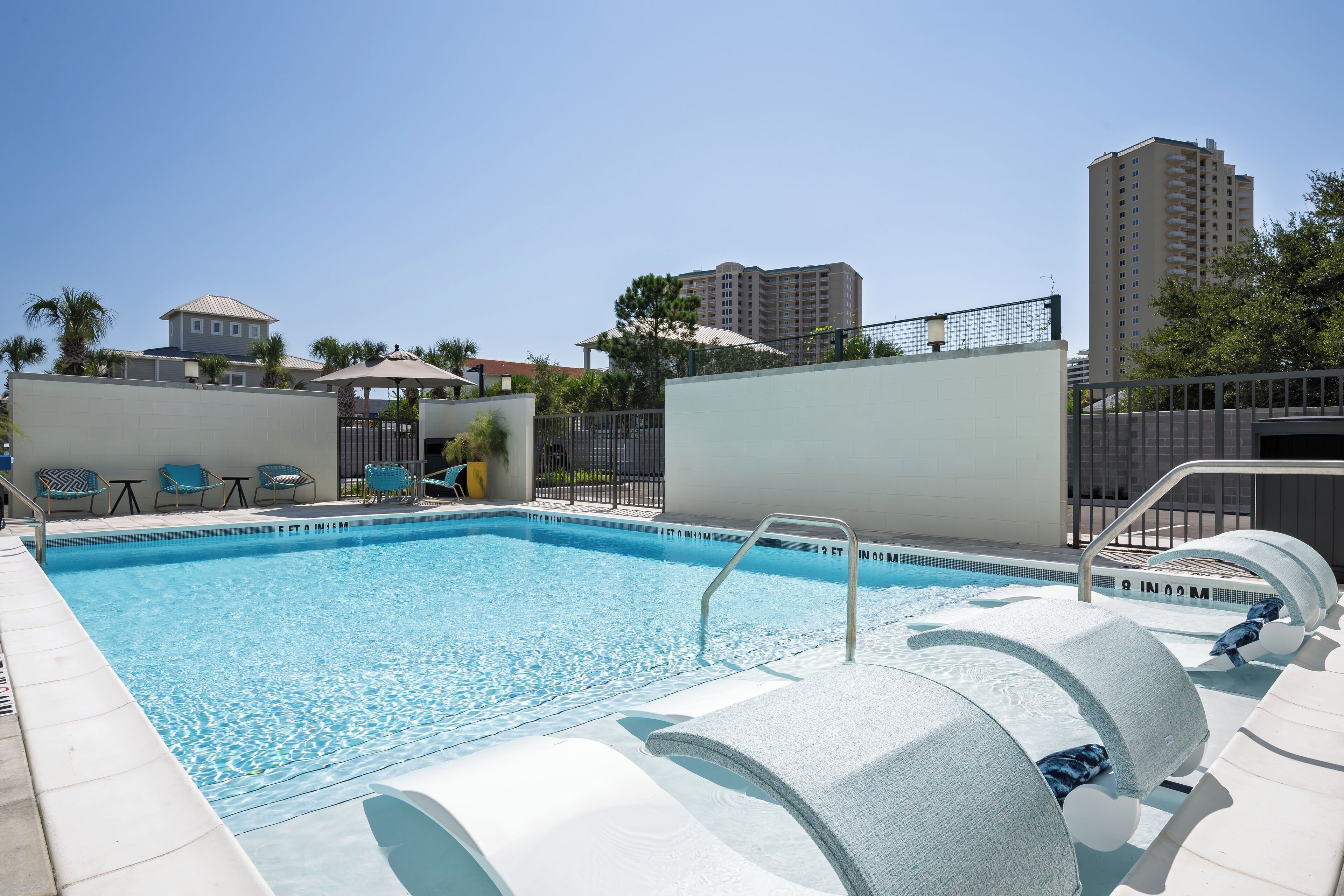 Seasonal outdoor pool, open 7:00 AM to 10:00 PM, sun loungers