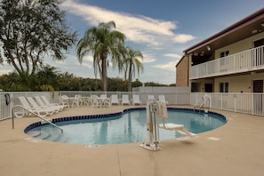 Outdoor pool, open 9:00 AM to 7:00 PM, pool umbrellas, pool loungers