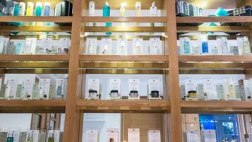 A multi-tiered display of various skincare products in a store.