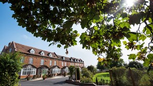 A large brick building with multiple windows and a covered entrance. - Worcester Bank House Hotel Spa & Golf, BW Premier Collection (Worcester)