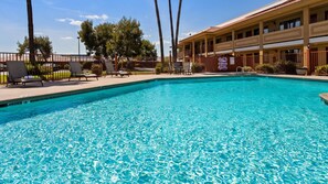Seasonal outdoor pool, open 10:00 AM to 10:00 PM, pool loungers
