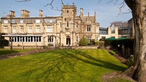 A historic building with a symmetrical facade, large windows, and a central entrance. - Mercure Bradford, Bankfield Hotel (Bingley)