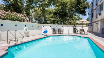 Outdoor pool, open 10:00 AM to 10:00 PM, pool loungers