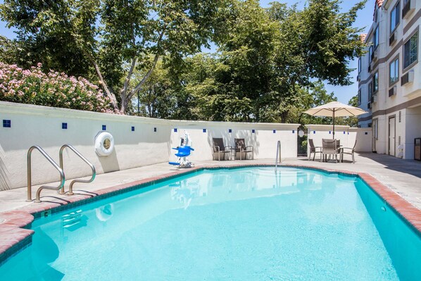 Outdoor pool, open 10:00 AM to 10:00 PM, sun loungers
