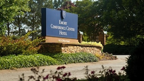 A sign for the Emory Conference Center Hotel with a stone base and a blue signboard. - Emory Conference Center Hotel (Atlanta)
