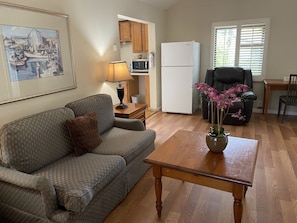 Standard Cottage, 2 Bedrooms | Living area | 32-inch flat-screen TV with cable channels, TV