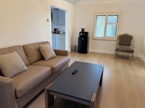 Standard Cottage, 2 Bedrooms | Living area | 32-inch flat-screen TV with cable channels, TV - Carmel Resort Inn (Carmel)