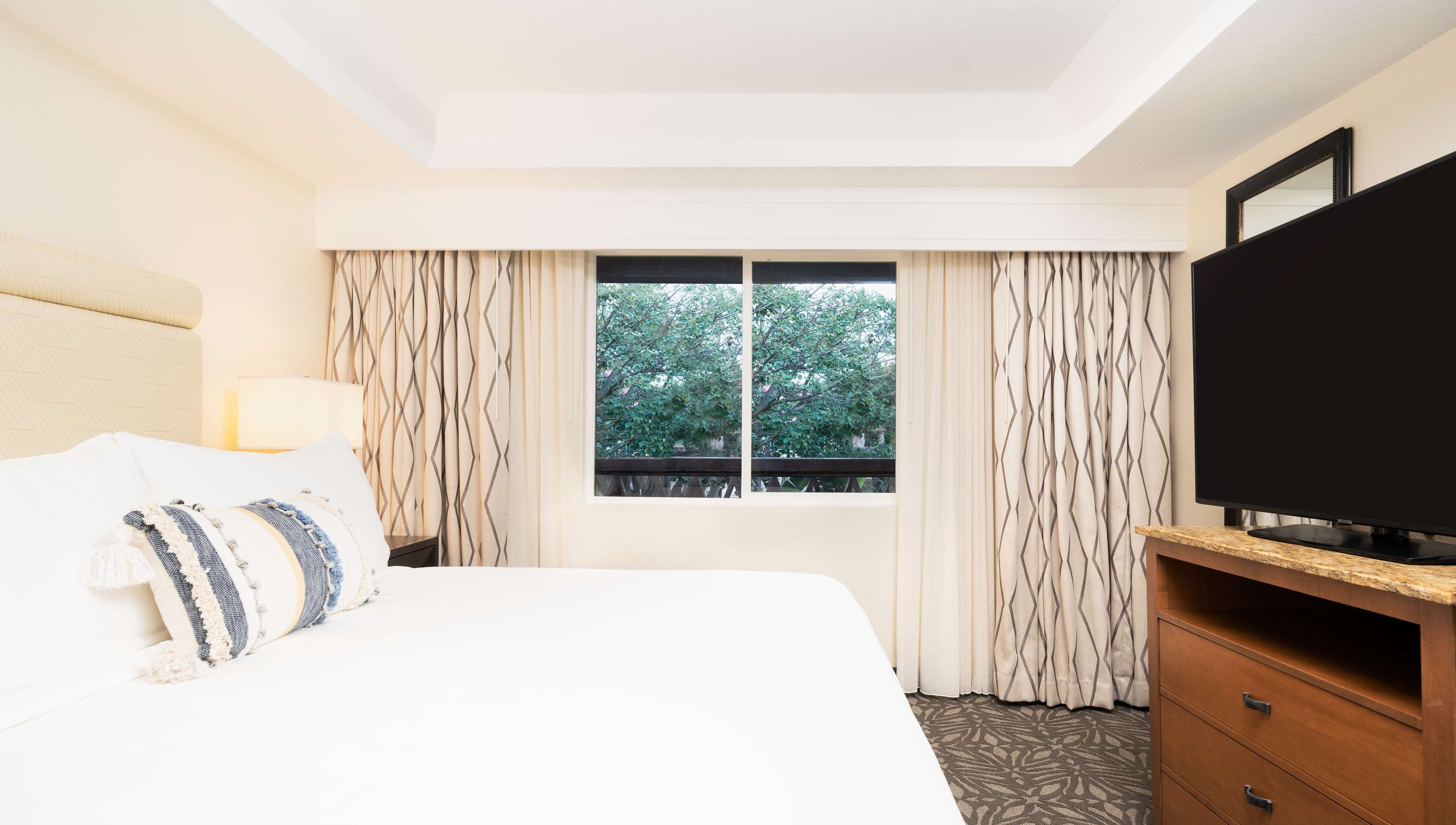 Suite, 1 Bedroom, Garden View | In-room safe, laptop workspace, blackout drapes, iron/ironing board