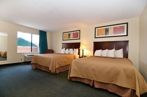 A hotel room with two beds, a window with a view, a desk, and a chair. - Quality Inn San Diego I-5 Naval Base (San Diego)
