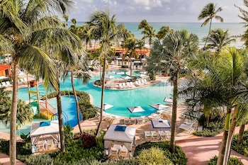 5 outdoor pools, open 8:00 AM to 10:00 PM, cabanas (surcharge) at Wyndham Grand Rio Mar Rainforest Beach and Golf Resort