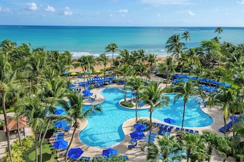 3 outdoor pools, open 8:00 AM to 8:00 PM, cabanas (surcharge) at Wyndham Grand Rio Mar Rainforest Beach and Golf Resort