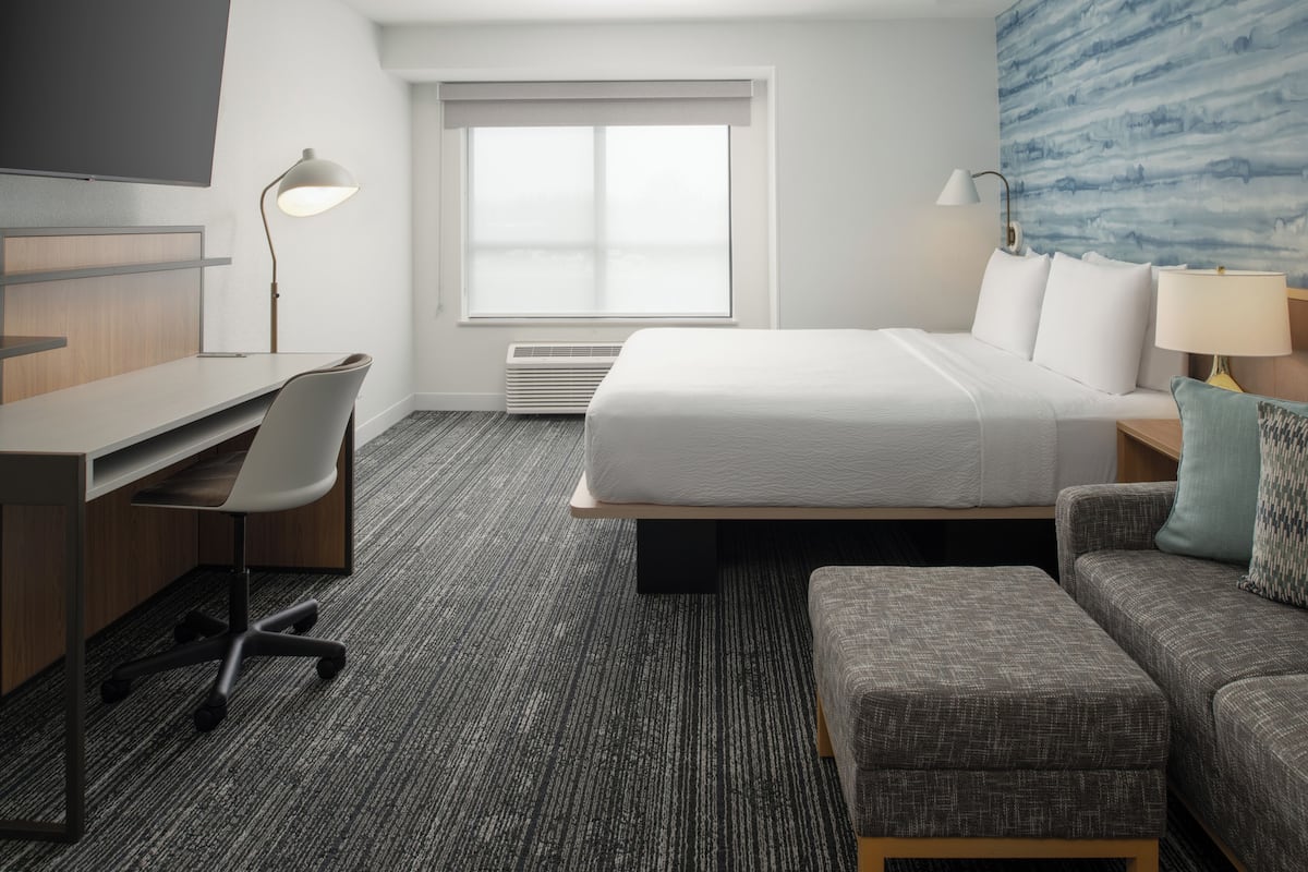 Desk, laptop workspace, blackout drapes, iron/ironing board