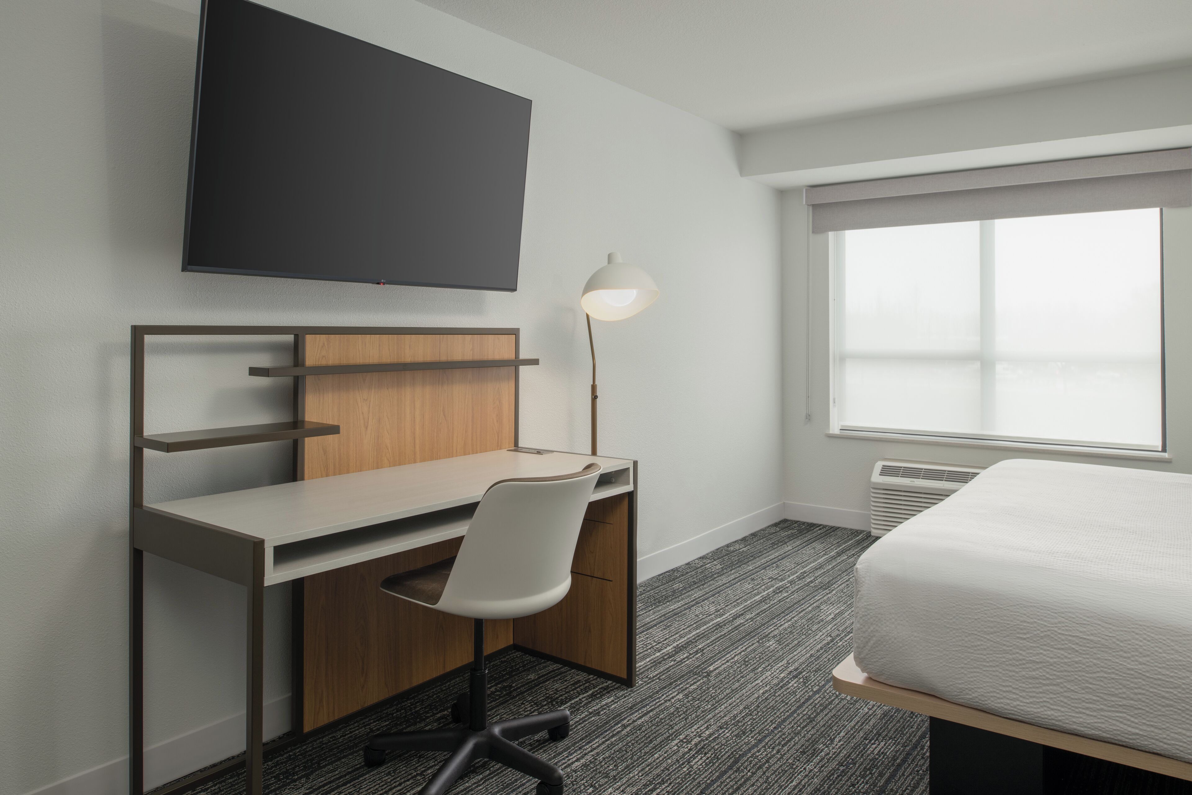 Desk, laptop workspace, blackout drapes, iron/ironing board