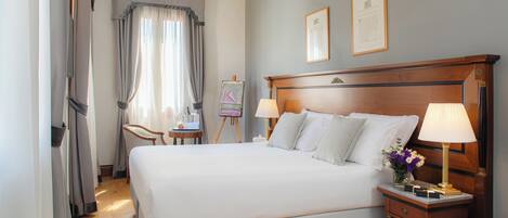 Deluxe Double Room | Minibar, in-room safe, desk, blackout drapes