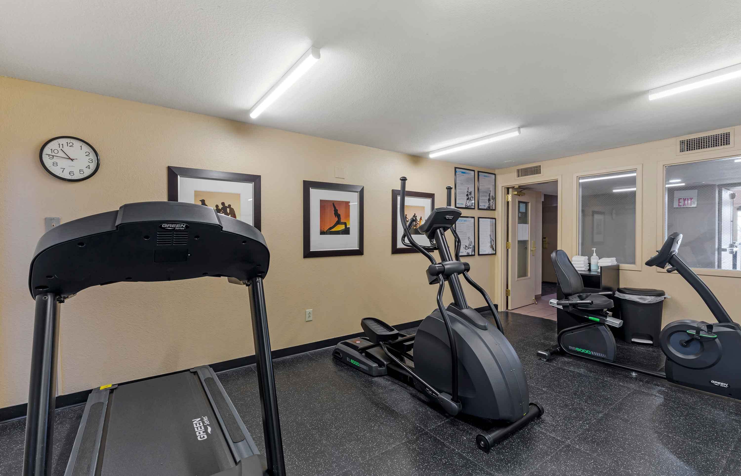 A fitness center with treadmills, an elliptical, and a stationary bike.