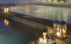Outdoor pool, a heated pool, pool umbrellas, pool loungers