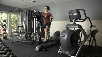 A gym with various exercise equipment, including treadmills and weight machines.