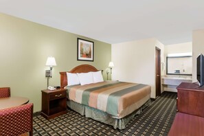 Standard Room, 1 King Bed, Smoking | Pillowtop beds, blackout drapes, iron/ironing board