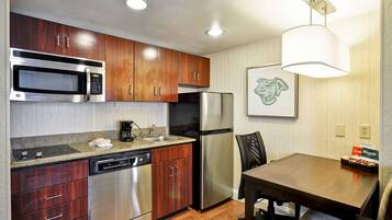 Full-size fridge, microwave, cookware/dishes/utensils