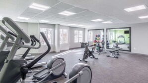 A gym with treadmills, elliptical machines, and a weight station. - La Quinta Inn & Suites by Wyndham Denver Tech Center (Greenwood Village)