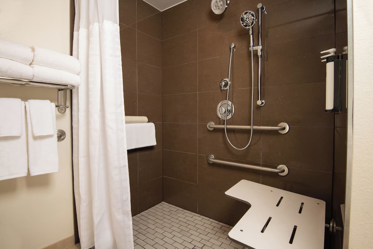 designer toiletries, hair dryer, towels