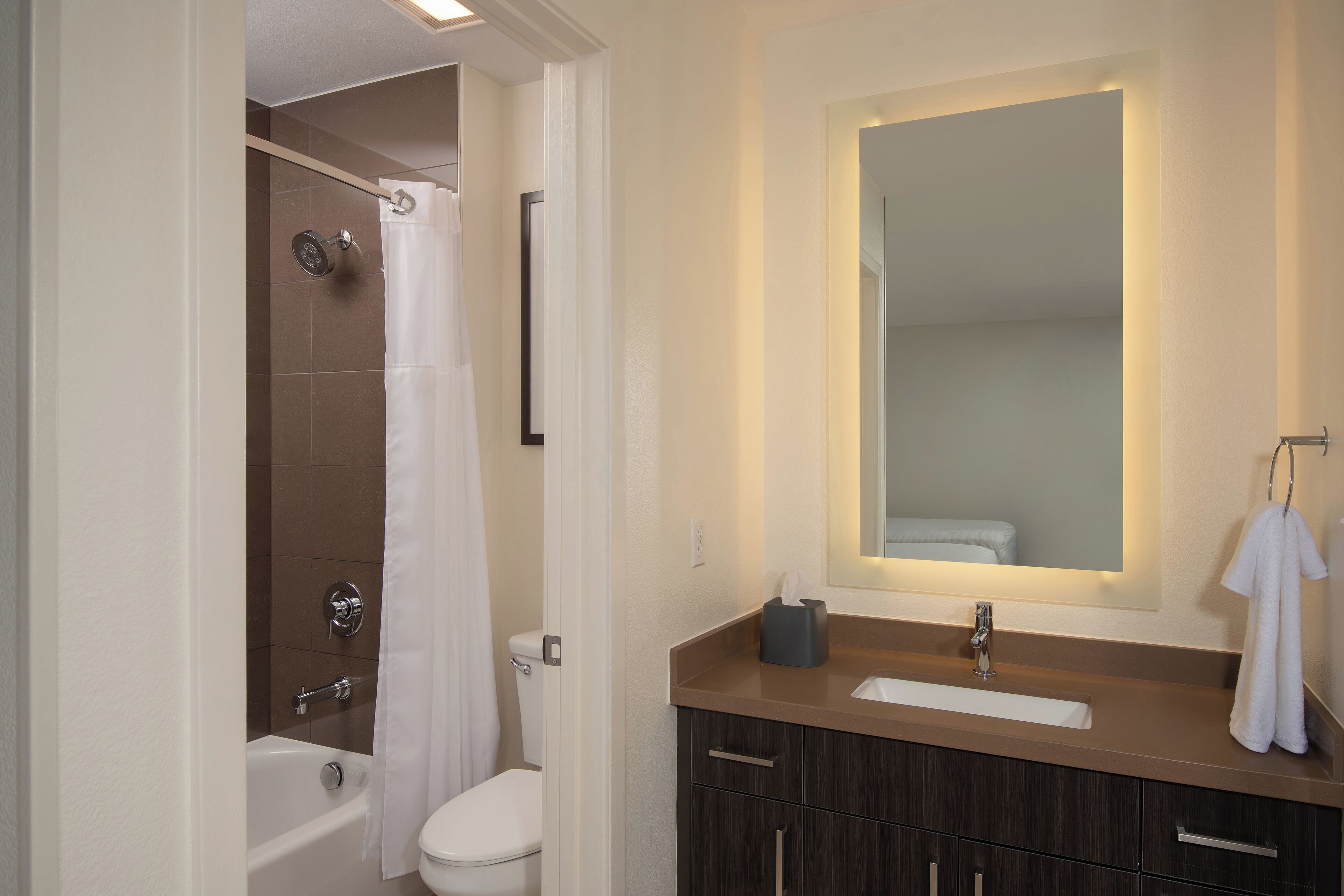 designer toiletries, hair dryer, towels