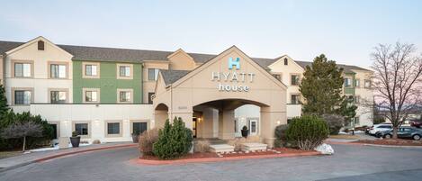A multi-story hotel with a prominent 'Hyatt House' sign.