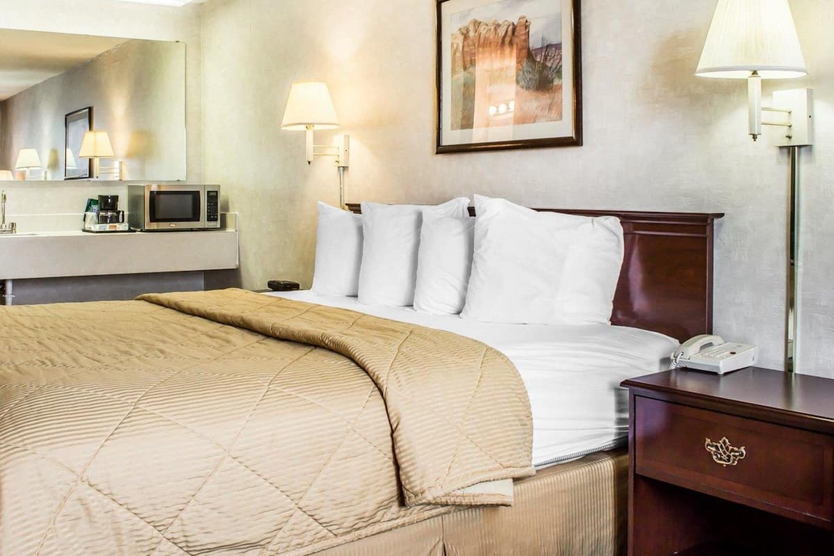 Premium bedding, pillowtop beds, laptop workspace, blackout drapes