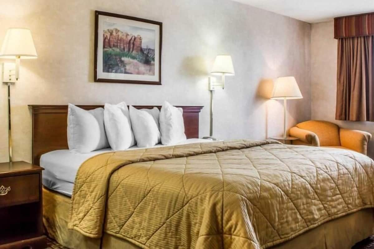 Premium bedding, pillowtop beds, laptop workspace, blackout drapes