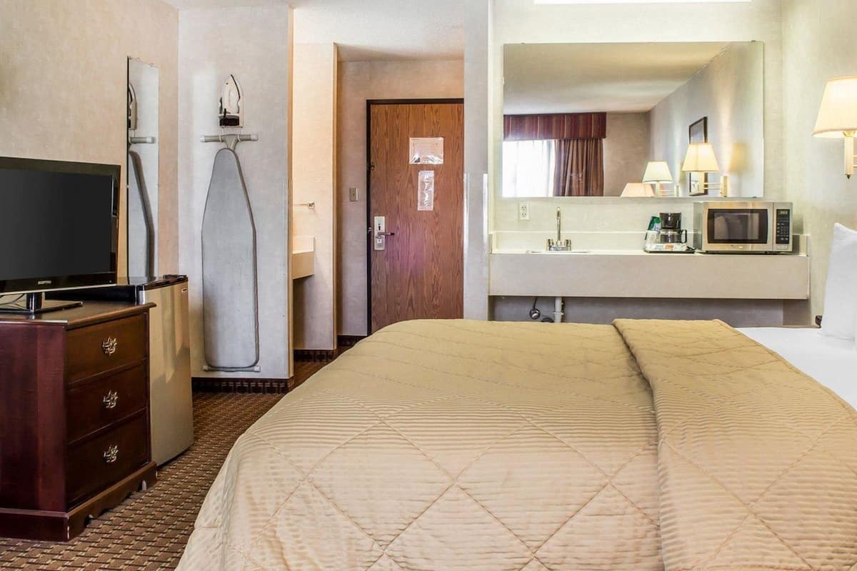 Premium bedding, pillowtop beds, laptop workspace, blackout drapes