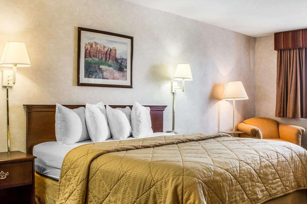 Premium bedding, pillow-top beds, laptop workspace, blackout curtains
